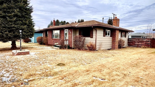 view of property exterior featuring a lawn