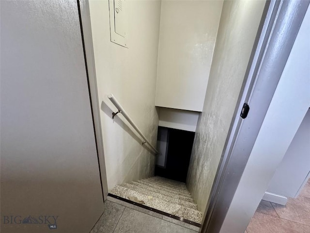 stairs with tile patterned flooring