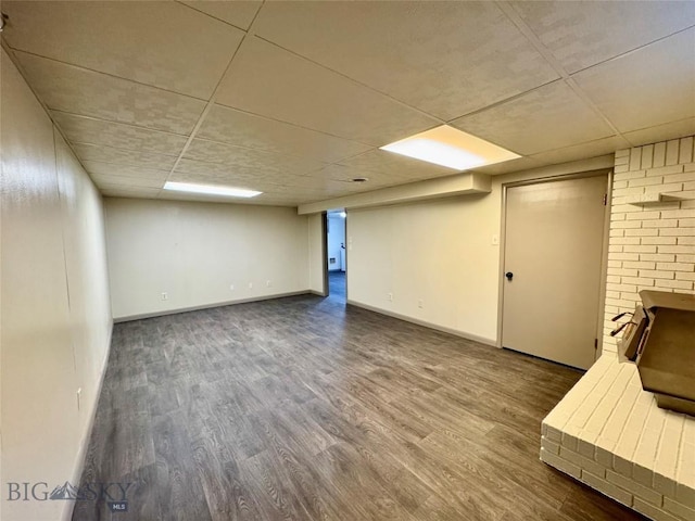 basement with hardwood / wood-style floors