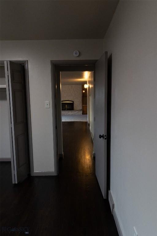 hallway with dark wood-type flooring