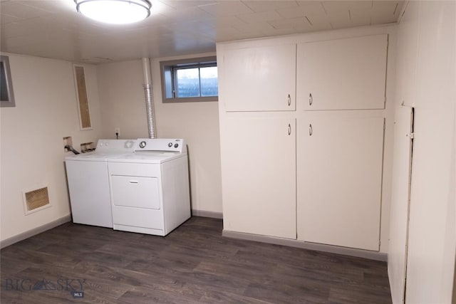 washroom with cabinets, dark hardwood / wood-style flooring, and separate washer and dryer