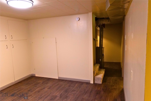 unfurnished room featuring dark wood-type flooring