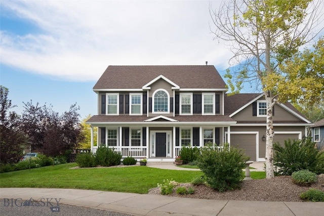 colonial home featuring a porch and a front lawn