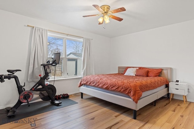 bedroom featuring light hardwood / wood-style floors and ceiling fan