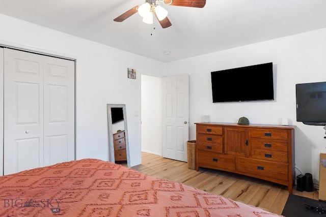 bedroom featuring a closet, light hardwood / wood-style flooring, and ceiling fan