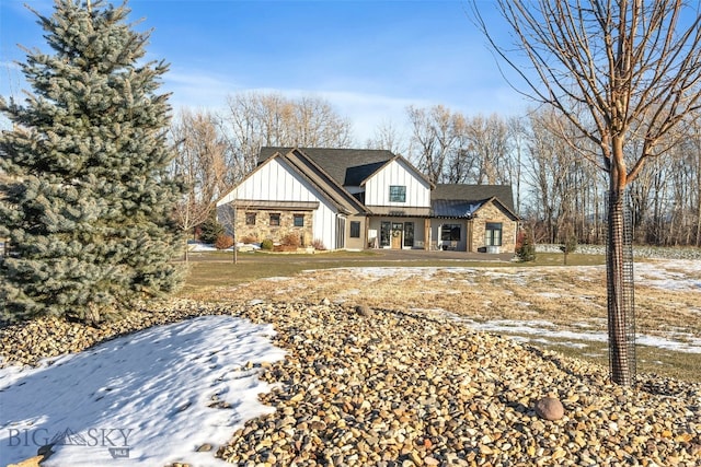 4807 Jordan Spur Rd, Bozeman, MT 59715 - modern farmhouse style home featuring board and batten siding and a shingled roof