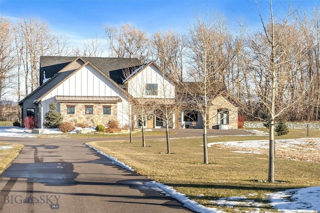 view of front of home with a lawn