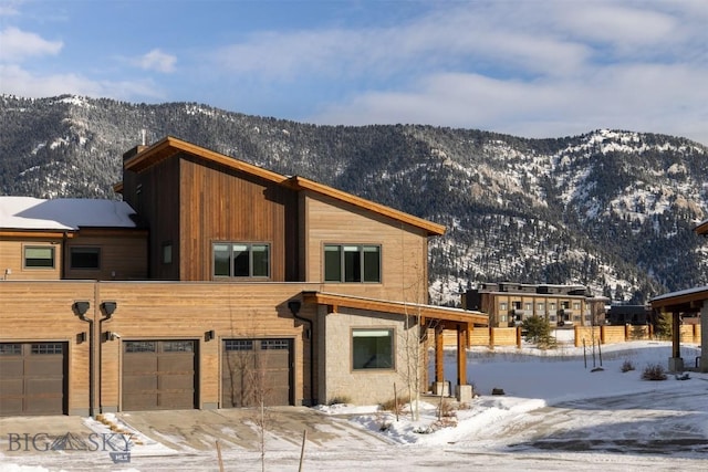 exterior space with a mountain view and a garage