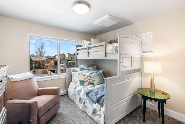 bedroom featuring carpet floors and a baseboard heating unit