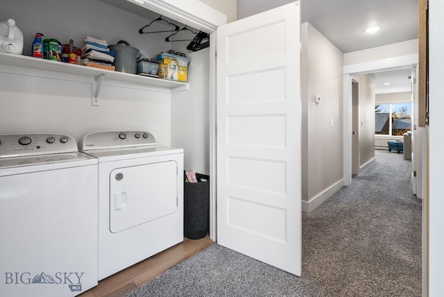 clothes washing area with washer and clothes dryer and dark carpet