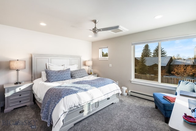 carpeted bedroom featuring baseboard heating and ceiling fan