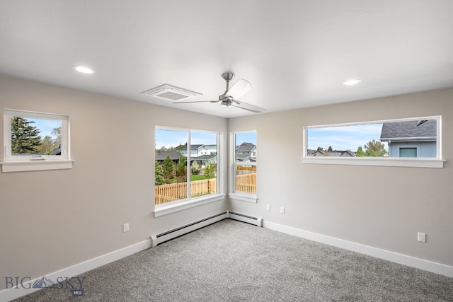 empty room featuring carpet, ceiling fan, and a baseboard radiator