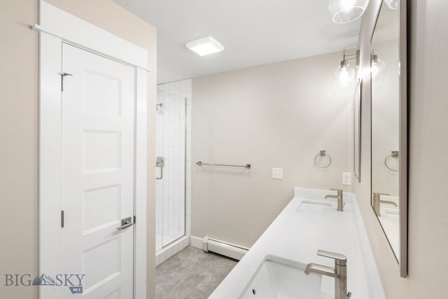 bathroom with vanity, walk in shower, and a baseboard heating unit