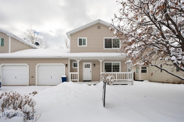 view of property featuring a garage and a porch