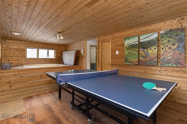 recreation room with hardwood / wood-style floors, wood walls, and wooden ceiling