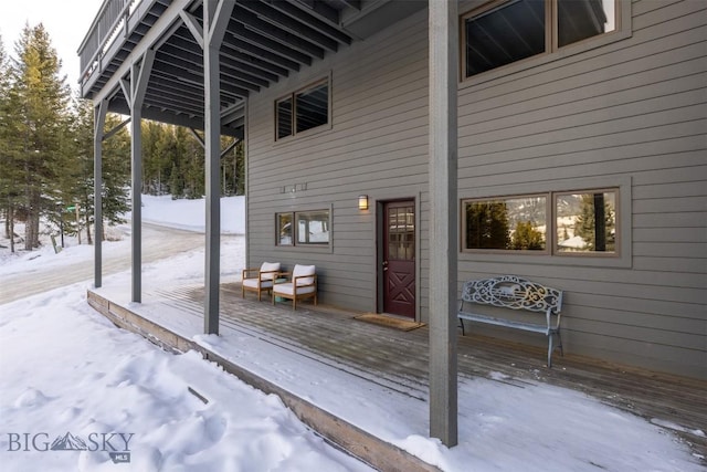 view of snow covered deck