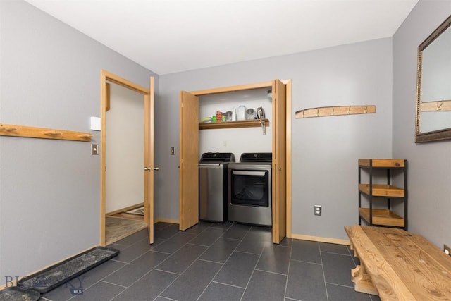 laundry area featuring washing machine and clothes dryer