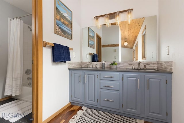 bathroom with wooden ceiling, backsplash, hardwood / wood-style floors, shower / bath combination with curtain, and vanity