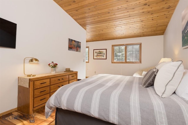 bedroom with lofted ceiling, wood-type flooring, and wooden ceiling