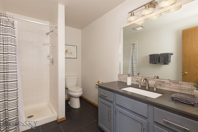 bathroom with tile patterned floors, vanity, a shower with shower curtain, and toilet