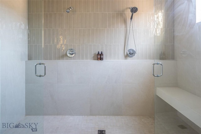 bathroom featuring an enclosed shower