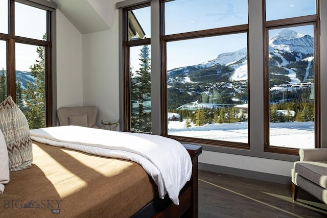 13 Middle Rider, Big Sky, MT 59716 - bedroom featuring a mountain view and wood finished floors