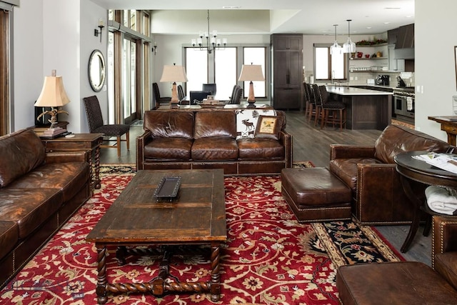 13 Middle Rider, Big Sky, MT 59716 - living room featuring a chandelier and wood finished floors