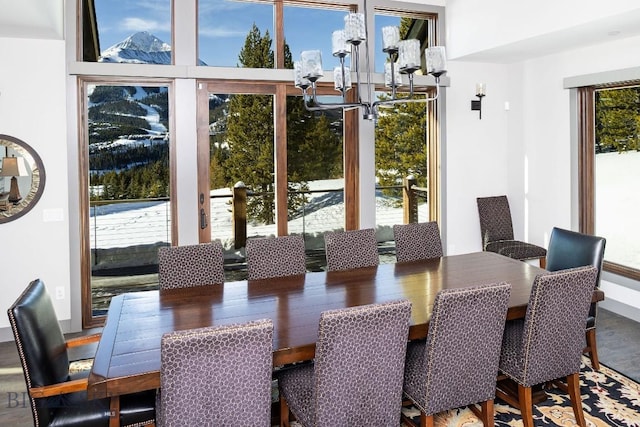 13 Middle Rider, Big Sky, MT 59716 - dining area with a chandelier and wood finished floors