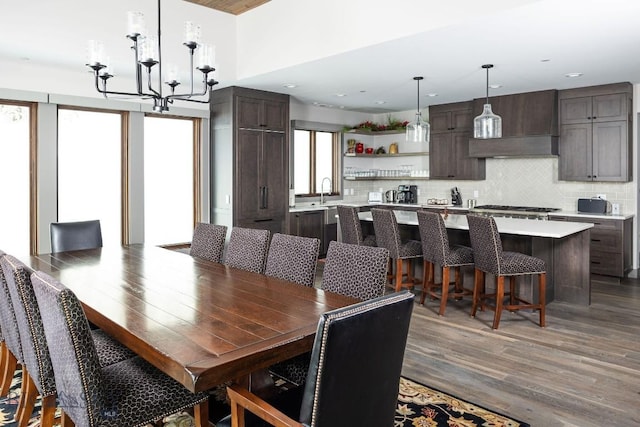 13 Middle Rider, Big Sky, MT 59716 - dining space featuring wood finished floors, a chandelier, and recessed lighting