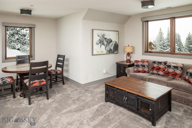 13 Middle Rider, Big Sky, MT 59716 - living room featuring plenty of natural light and light carpet