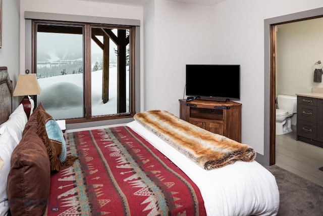 13 Middle Rider, Big Sky, MT 59716 - bedroom featuring ensuite bath and access to outside