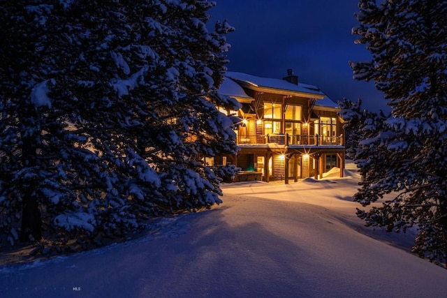 13 Middle Rider, Big Sky, MT 59716 - view of front of house with a chimney and a balcony