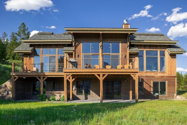 13 Middle Rider, Big Sky, MT 59716 - rear view of property featuring a chimney and a yard