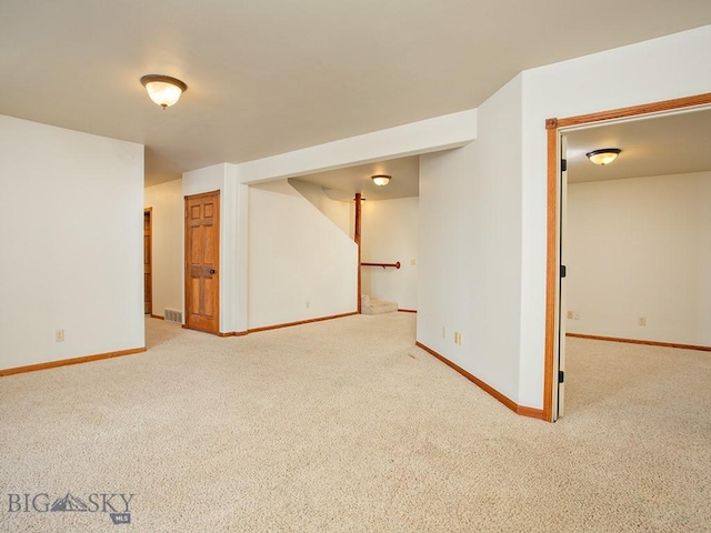 basement featuring carpet flooring