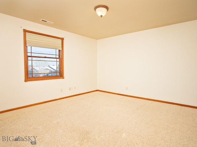 unfurnished room featuring carpet flooring