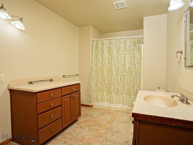 bathroom with vanity and shower / tub combo with curtain