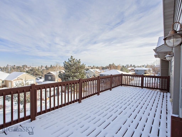 view of snow covered deck