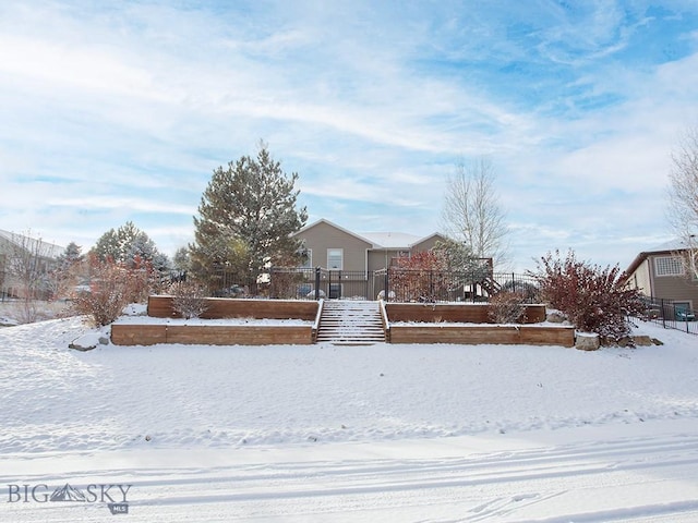 view of yard layered in snow