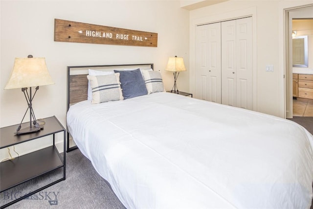 bedroom featuring dark carpet and a closet