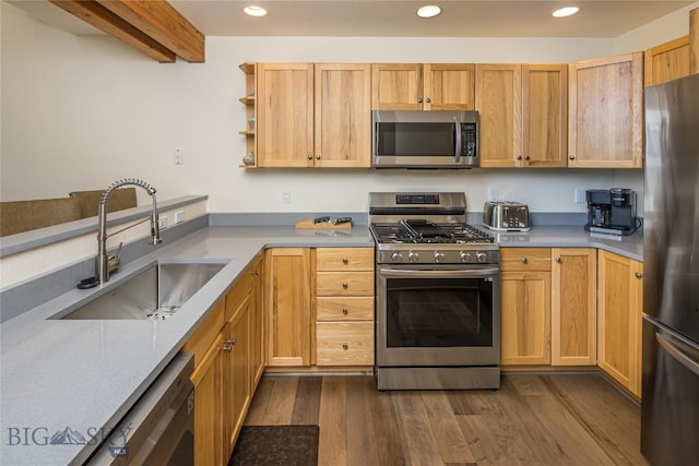 kitchen featuring sink, light brown cabinets, stainless steel appliances, beamed ceiling, and dark hardwood / wood-style floors