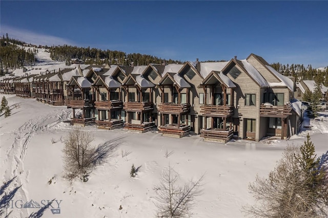 view of snow covered property