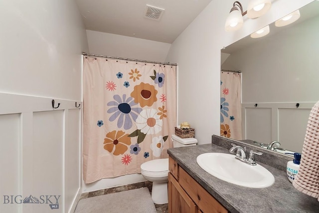 full bathroom with vanity, toilet, and shower / bath combo with shower curtain