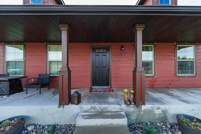 property entrance featuring covered porch