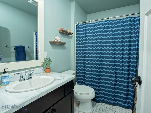 bathroom featuring vanity and toilet