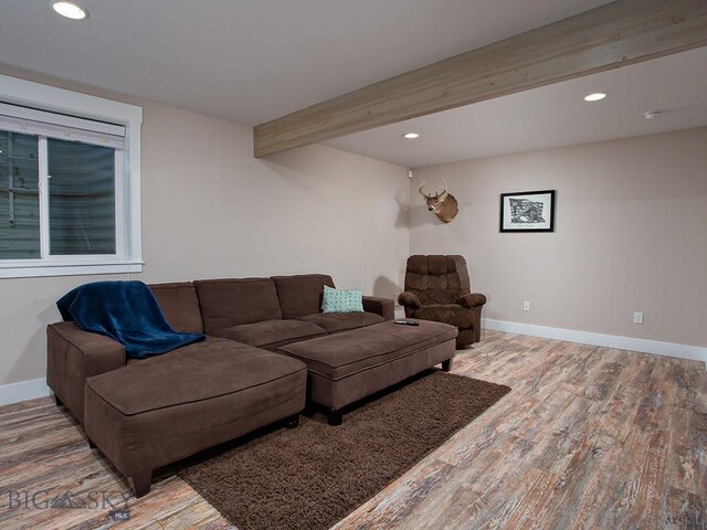 living room with wood-type flooring and beamed ceiling