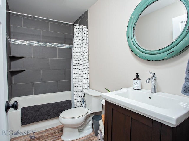 bathroom with hardwood / wood-style flooring, vanity, and toilet