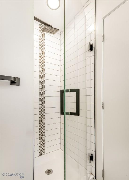 bathroom with an enclosed shower