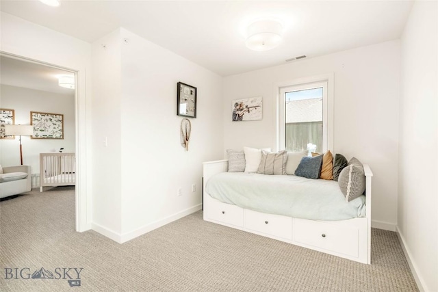 bedroom featuring light carpet