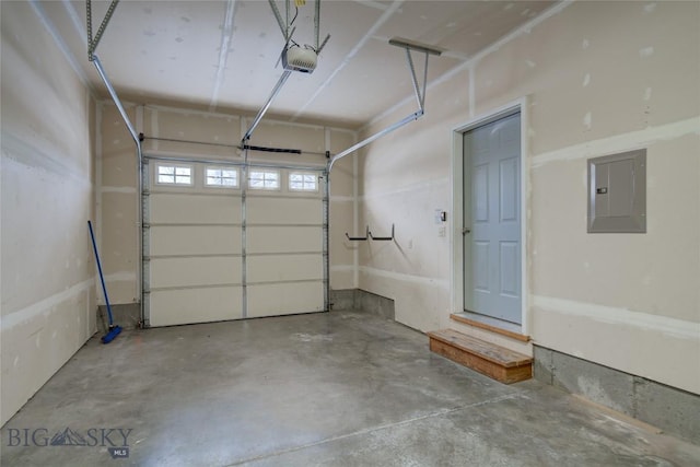 garage featuring a garage door opener and electric panel