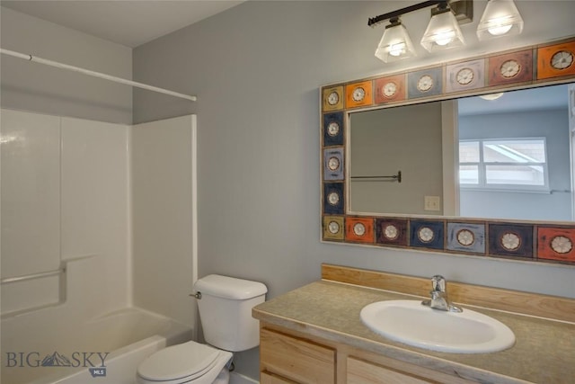 full bathroom featuring shower / bathing tub combination, vanity, and toilet